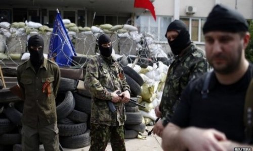 Troops 'retake Mariupol city hall'