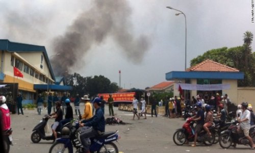 Protestors torch factories