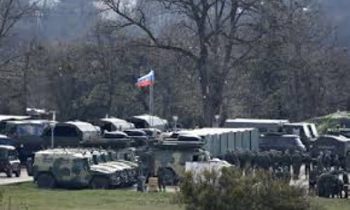 Russia says troops pulling back from Ukraine border