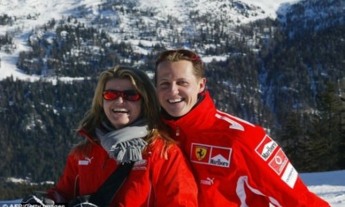 Schumacher's wife tells magazine he is 'getting better slowly'