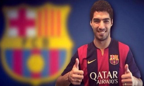 Suarez touches down in Spain to sign Barcelona deal