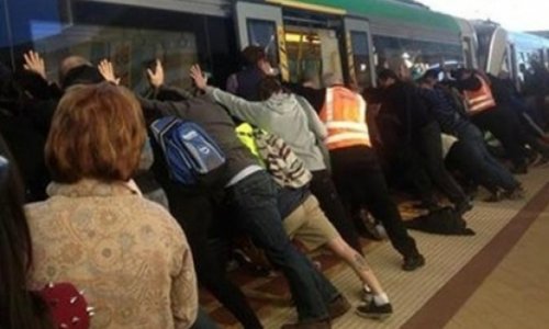 Passengers tilt train carriage to free man trapped in the gap