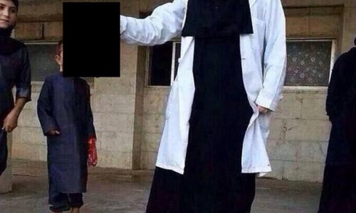 British jihadist medical student, 21, is pictured holding severed head - PHOTO