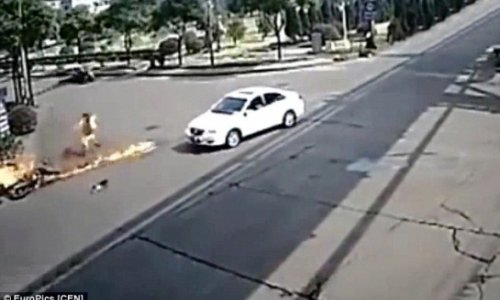Motorbike rider is turned into human fireball after hitting car... and SURVIVES - VIDEO