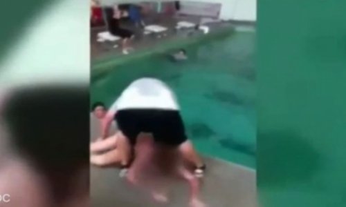 Teacher dragging girl, 14, into pool after she refused to swim - VIDEO