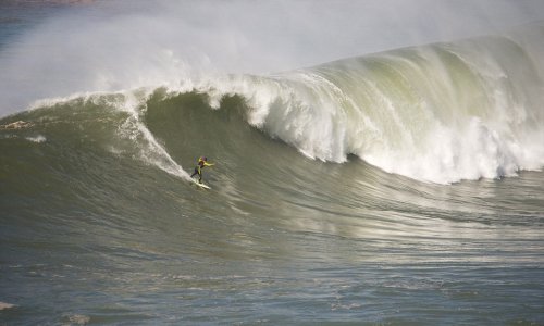 Thrill-seeker surfs through incredible waves