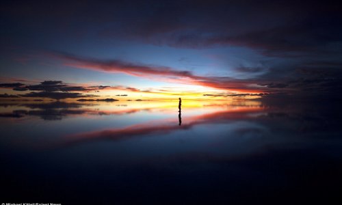 Skylines reflected in water create a dream-like background - PHOTO