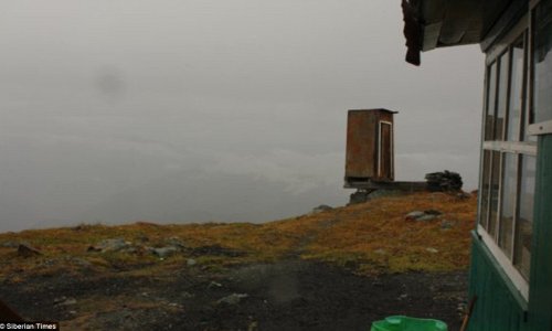 Precarious toilet is perched over 2,000ft Siberian cliff - PHOTO