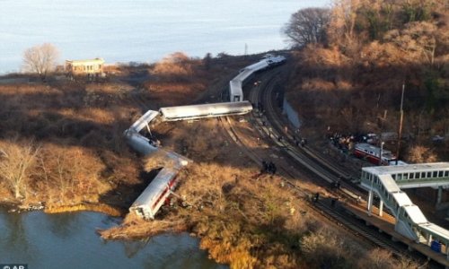 Four dead and 63 injured as all seven cars of a NYC commuter train fly off the rails