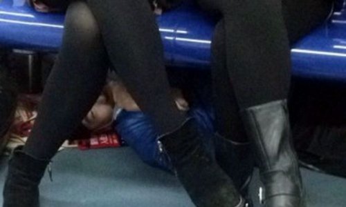 Pervert spotted hiding under seats on Beijing Metro trains - PHOTO+VIDEO
