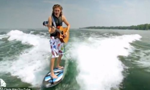 Musician who can play his guitar while riding his surfboard