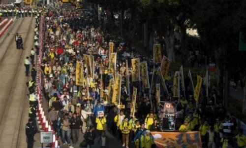 Thousands march in Hong Kong in escalating battle for democracy