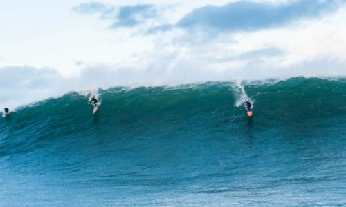 Surfers ride the storm in Europe - PHOTO