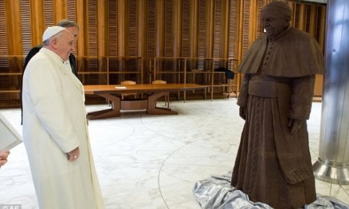 Francis is presented with a chocolate statue of himself