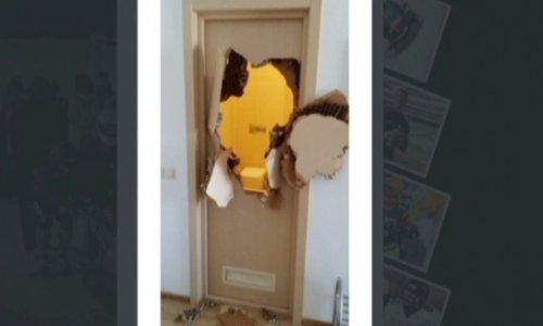 Trapped in Sochi bathroom, bobsledder punches hole in door