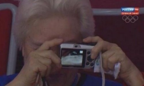 Elderly spectator snaps all the action at Sochi