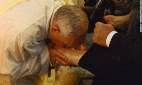 Pope Francis washes the feet of disabled people