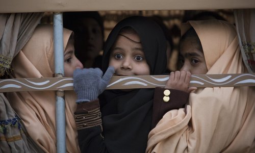 Pakistani school return to the scene where 133 of their classmates were slaughtered