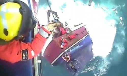 Dramatic footage shows moment fishermen cling