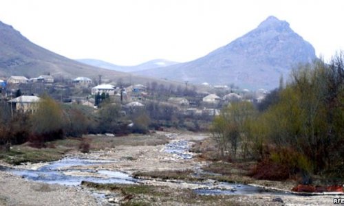 Azeri civilian injured, house burnt by Armenian fire