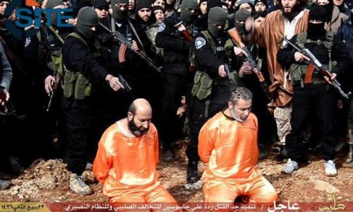 ISIS publicly executes two 'spies' and CRUCIFIES another