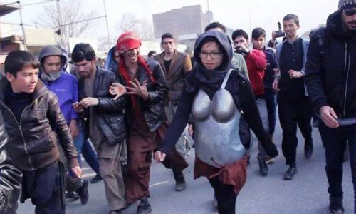 Woman in armour protesting against sexual harassment pelted with rocks