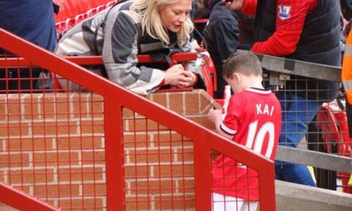 Kai Rooney, five, is asked for his AUTOGRAPH