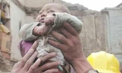 Incredible moment four-month-old baby is pulled ALIVE from the rubble