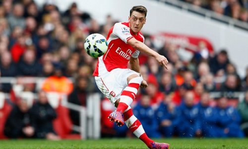 Arsenal midfielder Mesut Ozil shows his caring side