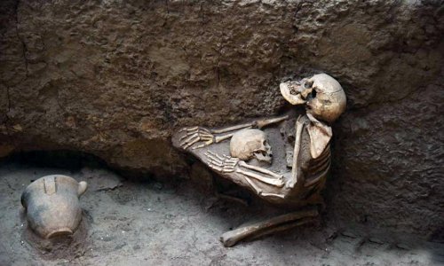 4,000-year-old skeletons of mother and child are found locked