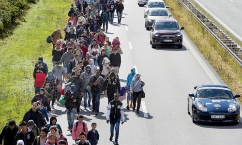 Европарламент принимает беженцев