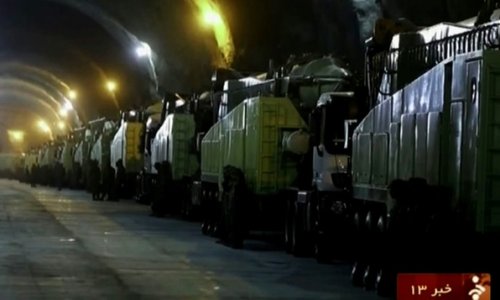 Iran reveals underground tunnel filled with missile launchers