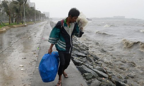 Typhoon ploughs into Philippines killing two people and leaving 23,000 more without homes