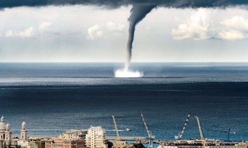 Incredible moment a massive waterspout descended on Italian coastal town