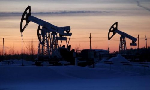 Oil jumps as sentiment gets boost, but analysts warn of ongoing glut