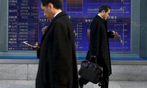 Asian shares slide, frazzled by Fed, falling oil prices