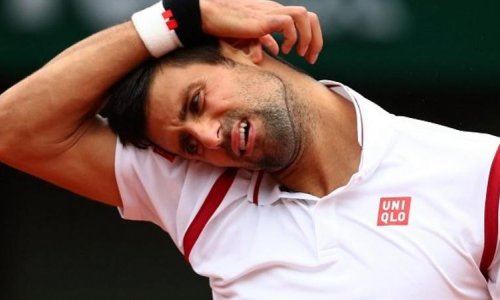 Novak Djokovic leads Roberto Bautista Agut when rain returns