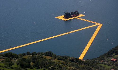 Thousands of tourists flock to Italian lake to stroll on a 1.9-mile floating art installation
