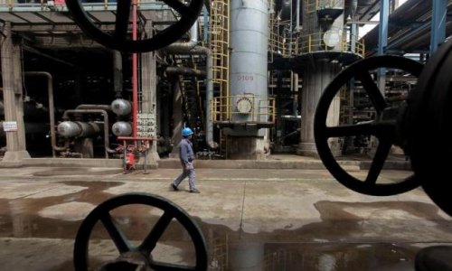 Oil stable as market seen in balance, but slow Asian demand hurts