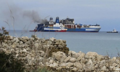 British Navy says attacked ship ablaze off the coast of Yemen