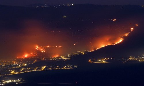 Fires rage in northern Israel after rocket attacks; key roads closed off