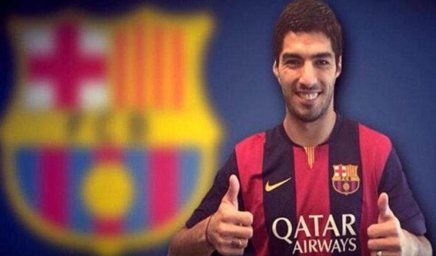 Suarez touches down in Spain to sign Barcelona deal