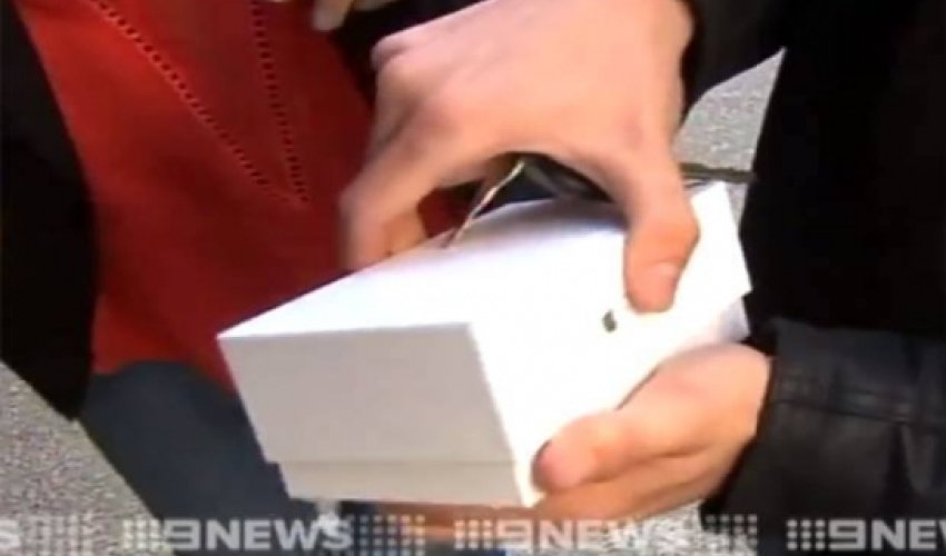 First man to buy an iPhone 6 immediately drops it on the floor, live on telly - VIDEO First man to buy an iPhone 6 immediately drops it on the floor, live on telly - VIDEO