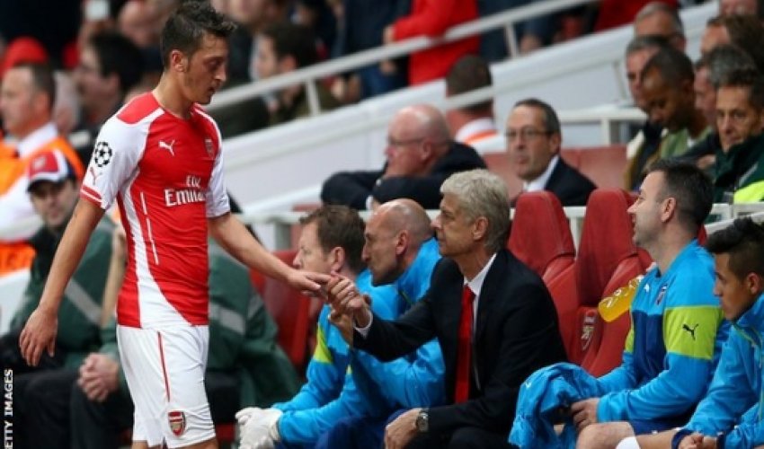 Mesut Ozil: Arsenal midfielder out with knee injury for up to 12 weeks