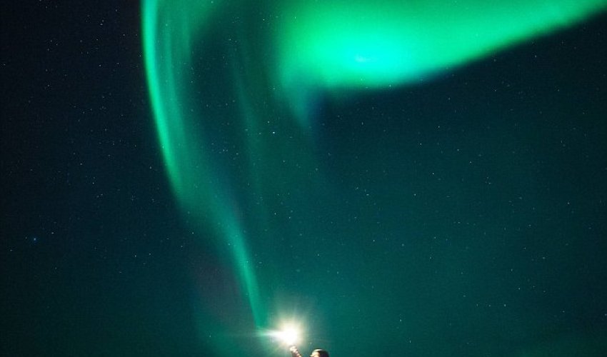 Magical moment a stargazer appears to grab an orb out of the sky - PHOTO Magical moment a stargazer appears to grab an orb out of the sky - PHOTO