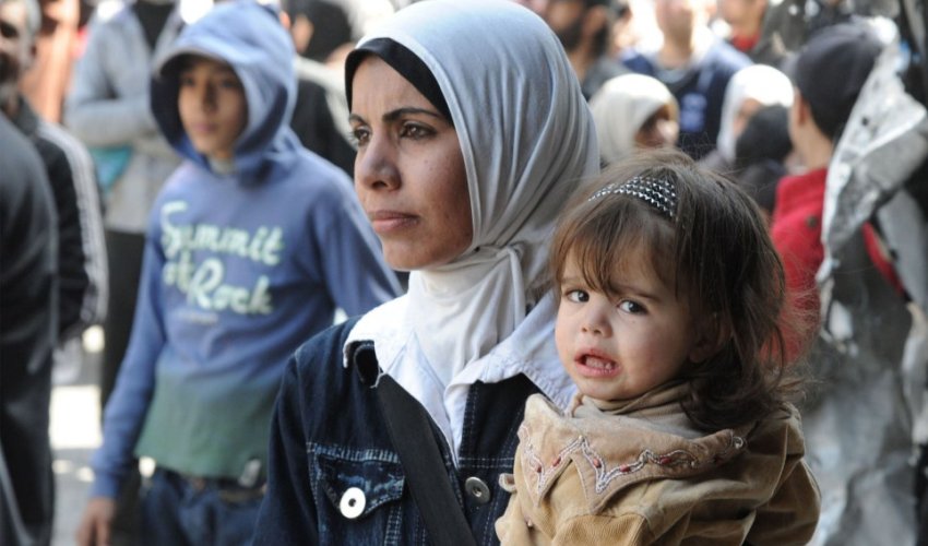 A crowd in Syria stretches as far as the eye can see for UN food hand-outs - PHOTO A crowd in Syria stretches as far as the eye can see for UN food hand-outs - PHOTO