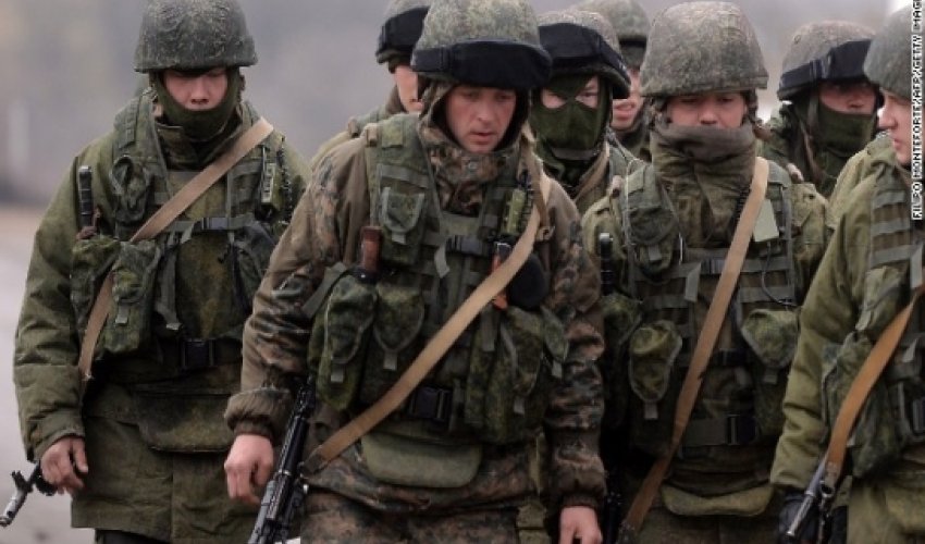 Germany: Putin says he's pulling some troops back from Ukrainian border