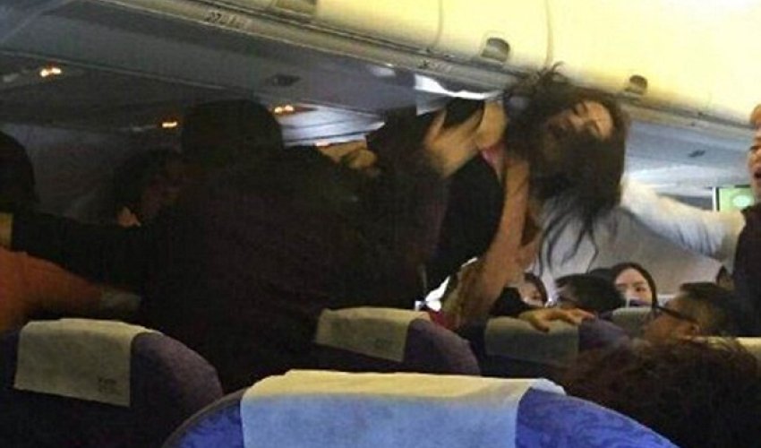 Pilot threatens emergency landing after...