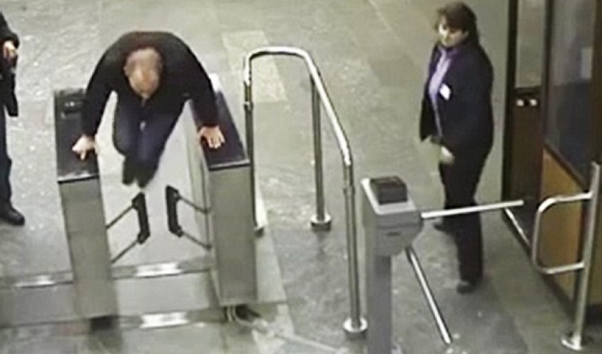 Ukrainian man tries to jump over 1ft-high ticket barrier but... Ukrainian man tries to jump over 1ft-high ticket barrier but...