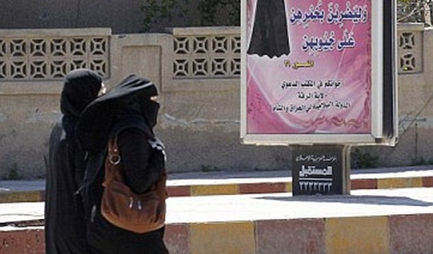 ISIS morality police arrest a woman wearing full burkha and face veil